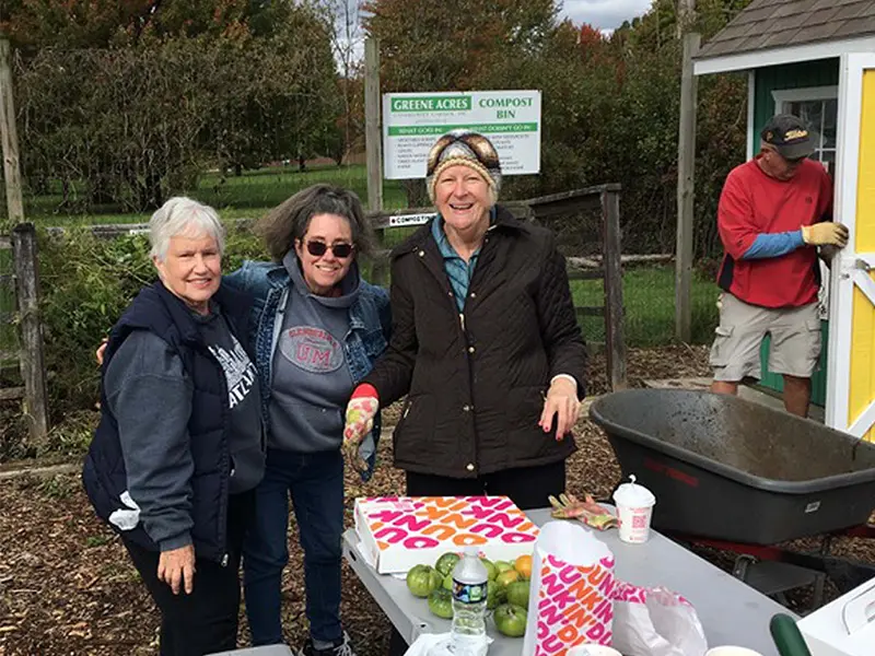 people standing around a table